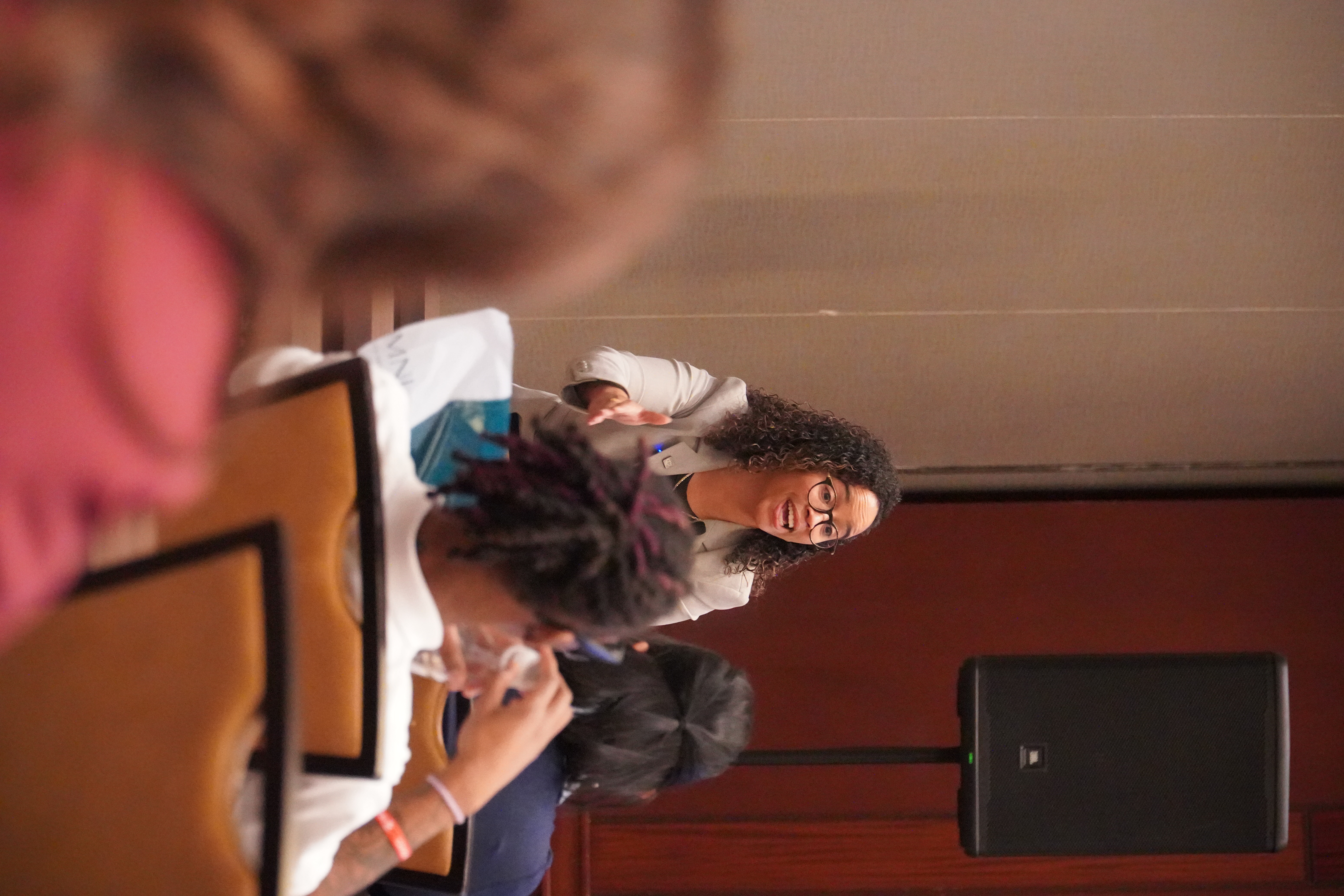 Joanna speaking on stage